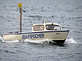 Professional fisherman in Lake Zürich