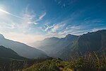 A scenic view of Pampadumshola Mountains