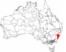 A black and white outlined map of Australia, with a small red section at the bottom left corner of New South Wales, indicating that this region is the Sydney Basin.