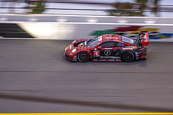 Porsche 992 GT3 R on the banks of the Daytona International Speedway.