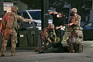 Georgia National Guard medics treat a protester injured by tear gas on June 2, 2020