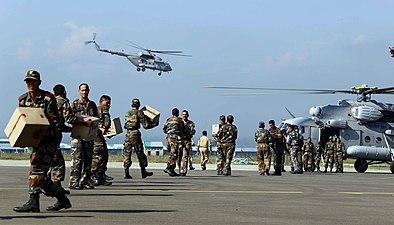 Relief materials are being loaded in an Indian Air Force helicopter for distribution among the flood affected people