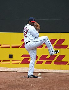 A man in a pitching motion