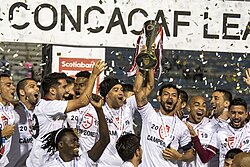 Saprissa players celebrate winning the CONCACAF League in 2019.