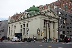 View of the New York Savings Bank Building at the northwest corner of 14th Street and 8th Avenue in 2019. There are several pieces of signage indicating that the building is being used as a CVS Pharmacy.