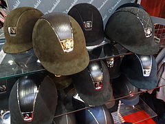 Equestrian helmet covered with shiny lines.