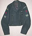 No.2 Battledress blouse (1948) showing medal ribbon bar and plastic beacon lighter buttons. Sleeves: Shoulder flash, Group numeral, Red "Spitfire" proficiency and Leading Observer rank badges.