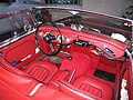 The red leather cockpit of a black Austin-Healy 3000