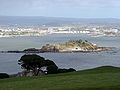 Image 34Northeastward view of Plymouth Sound from Mount Edgcumbe Country Park in Cornwall, with Drake's Island (centre) and, behind it from left to right, the Royal Citadel, the fuel tanks of Cattedown, and Mount Batten; in the background, the hills of Dartmoor. (from Plymouth)