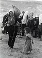 Palestinian woman a baby and a jug, Nakba.