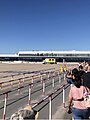 Arrivals walk towards terminal of REU.