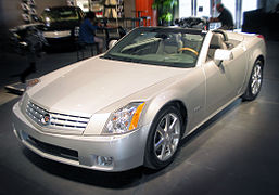 Cadillac XLR c. 2007, with fully retracted aluminum (i.e., lightweight) hardtop concealed by self-storing tonneau cover, the hardtop manufactured by a supplier joint venture of Mercedes-Benz and Porsche[23]