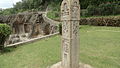 The inscribed Kiratarjuna pillar, now near lower cave, restored from the Durga temple hill above.