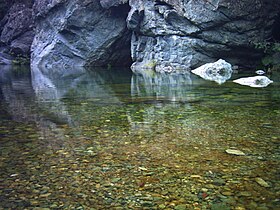 Calm water on the Fiumorbo upstream of the Pinzalone bridge