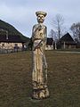 Wooden carved sculpture at the entrance to the village