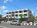 A row of six reinforced concrete shophouses in Pekanbaru, Indonesia.