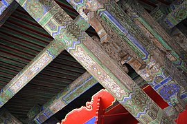 Decorations on support beams inside a palace of the Forbidden City.