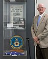 Sherman Wetmore poses next to a collection of Project AZORIAN artifacts on display.