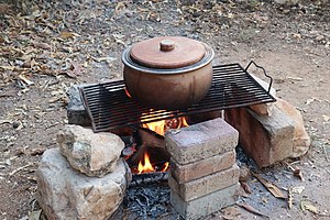 Earthenware pot laid over a gridiron