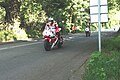 Racing motorcyclists approaching Ballacraine.