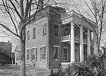 Kirkpatrick mansion on Oak Street, burned in 1935. The two-story brick slave quarters at the rear remains intact.