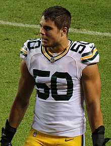 Martinez in his uniform on a football field