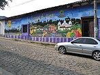 Colonial life themed mural in Ataco