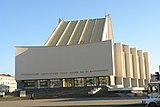 Blocky, somewhat modern light-colored building