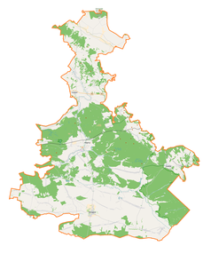 Mapa konturowa powiatu biłgorajskiego, u góry znajduje się punkt z opisem „Kościół św. Dominika”