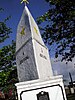 A stone pylon with two gold stars at the sides, below of which are inscribed "A Jose Rizal".