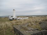 Walney Lighthouse with two attached cottages and outbuildings