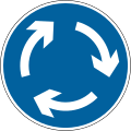 Mini-roundabout; vehicles must give way to traffic from the right and pass to the left of the central markings unless physically unable to do so