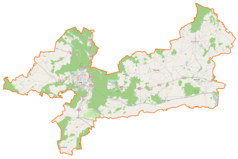 Mapa konturowa powiatu pilskiego, blisko centrum na dole znajduje się punkt z opisem „Kościół Podwyższenia Krzyża Świętego w Miasteczku Krajeńskim”