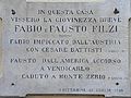 La lapide (sulla casa natale di Rovereto) che ricorda l'irredento Fausto Filzi (fratello di Fabio) caduto presso località croce di S. Antonio.