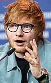 Sheeran addressing a press conference