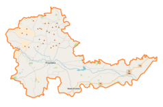 Mapa konturowa powiatu proszowickiego, na dole po lewej znajduje się punkt z opisem „Karwin”