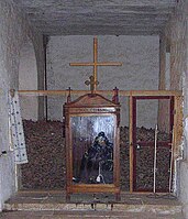 Skeleton of the monk Stephanos, in his robe, in front of the ossuary