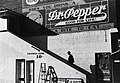 Image 5 Racial segregation in the United States Photo: Marion Post Wolcott; Restoration: Lise Broer An African American man climbs the stairs to a theater's "colored" entrance in Belzoni, Mississippi, in 1939. The door on the ground floor is labeled "white men only". De jure (legally enforced) racial segregation in the United States was eliminated by a series of Supreme Court decisions starting with Brown v. Board of Education in 1954. More selected pictures