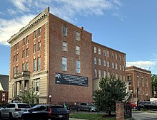 Photograph of a four-story brick and limestone Renaissance Revival building, which housed the Twelfth Street YMCA