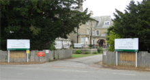 Photograph showing the main entrance of Langham Oaks School with the main school building set in the background