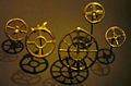 "wheel pendants", dating to the second half of the 2nd millennium BC, found in Zürich, kept in the Swiss National Museum. Variants include a six-spoked wheel, a central empty circle, and a second circle with twelve spokes surrounding the four-spoked one.