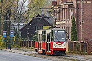 Konstal 105Na, modernized in 2011, with rolling stock number #254, passes the Biskupice Ziemska (on-demand) stop in Zabrze.