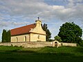 Small St. George Church, surrounded with cemetery, stands in the middle of remains of Slavic fortified settlement from 9th - 11th centuries CE. The original Přemyslids' domain, the core area of emerging Czech state encompassed the present day districts of Kladno and Prague-West.