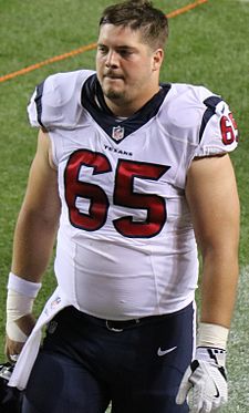 Photo of Mancz in a white Houston Texans number 65 jersey walking on a football field in 2016