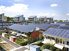 Photograph of buildings incorporating rooftop solar panels