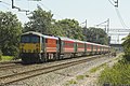 A Class 87 electric locomotive and Mark 3 coaches franchised by Virgin Trains. There is little pollution!