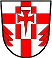 a cross enhanced - Argent; a cross enhanced gules, over all a billet charged with a cross pattée fitchée, all counterchanged and in base issuant from each flank a demi fir tree in pale gules - St. George's Church Pickering Village, Canada