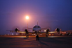 Man directing a plane on a runway