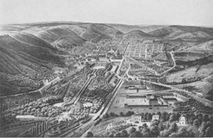 Blick vom Rebenberg auf Stuttgart. Am Bildrand unten rechts: die drei Gebäude der Villa Rebenberg, um 1860. → Bildkommentar.