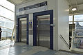 Station lifts from concourse leading to the enclosed waiting room, September 2013